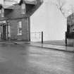View of 72 Main Street, Glenluce, from south west, showing A F Little tobacconist and confectionary.