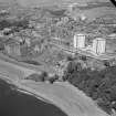 Oblique aerial view centred on Ravenscraig Castle, Kirkcaldy, showing Pathhead tower blocks and Ravenscraig Maltings from east.