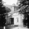 Copy of historic photograph showing detail of entrance gateway and cupola.