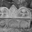 View of fragment of top of gravestone dated 1724 in the churchyard of Clackmannan Parish Church.