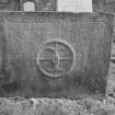 View of west face of gravestone with miller's stone and initials 'W S' and 'M A' in the churchyard of Alloa Old Parish Church.