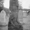 View of gravestone sculpture of mother and child (no name) in the churchyard of St Columba's Old Parish Church, Kirkcolm.