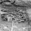 Excavation photograph : view of relationship of wall 500 and 104, 117 in sondage on west side of ruins, looking east.