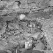 Excavation photograph : view of relationship of wall 503 and 106, 116 in sondage on west side of ruins, looking west.