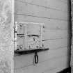 View of old wooden lock on door through curtain wall, Braemar Castle.