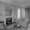 Interior view of Corsindae House showing drawing room with fireplace.
