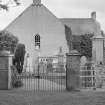 General view of Kiltearn Parish Church and gates to churchyard.