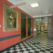 Entrance Lobby. Detail of corridor with portrait and plaques, from east.