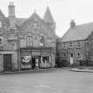 General view of Savings Bank, M &D Co-Operative shop and Fountain House, High Street, Falkland, from south east.
