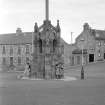 View of the Mercat Cross, The Square, Cullen from S.