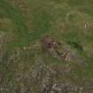 Oblique aerial view of Traprain Law fort centred on summit excavations undertaken in July 1997, taken from the E.