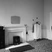 Interior view of Cairness House showing bedroom with a fireplace.