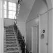 Interior view of Cairness House showing staircase to right of front.