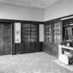 Interior view of Cairness House showing room to left of entrance hall (library) with fireplace.