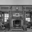 Interior view of Grandhome House, Aberdeen showing detail of fireplace in library.