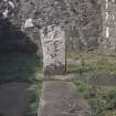 Eigg, Kildonnan, St Donnan's Church. View of grave-slab and headstone within church interior.