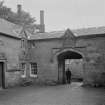 View of Blairquhan Castle showing gateway to courtyard from W.