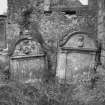 View of two gravestones in the churchyard of Glencorse Old Parish Church.