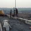 M8, Monklands Motorway, Easterhouse Road Motorway Bridge
One 35mm colour negative.
Frame 2: Detail of work erecting safety barriers to bridge.