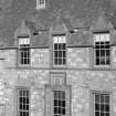 Detail of W elevation of courtyard, Cullen House showing carved pediments.