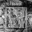  View of tomb recess in N wall showing detail of ornamental panel, St Donnan's Church, Kildonnan, Eigg.