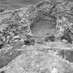 Excavation photograph showing entrance way, post holes and timber 'floor'

