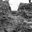 Excavation photographs showing excavation team at work-outside wall dismantled

