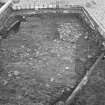 Edinburgh Castle, settlement. Excavation photograph showing area H - patchy cobbling in N part of area.