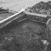 Edinburgh Castle, settlement. Excavation photograph showing area H - S part of first cut, 211 partially removed onto bedrock, cobbling 208/212 in background.