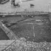 Edinburgh Castle, settlement. Excavation photograph showing area H - cobbling at S end of N trench as first exposed.