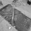 Edinburgh Castle, settlement. Excavation photograph showing area H (north) - aerial view of cobbling to south, rubble 255, cut by slots and wall footings.