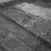 Edinburgh Castle, settlement. Excavation photograph showing area H - group of linear features cutting 265 with 254 wall in background.