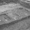 Edinburgh Castle, settlement. Excavation photograph showing area H - group of linear features cutting 265 with 254 wall in background.