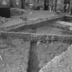 Edinburgh Castle, settlement. Excavation photograph: area H - cobbling fully exposed with rod on S edge.