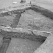 Edinburgh Castle, settlement. Excavation photograph showing area H - cobbling fully exposed with rod on S edge.