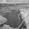 Edinburgh Castle, settlement. Excavation photograph showing area H - surface of midden, N of well.