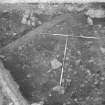 Edinburgh Castle, settlement. Excavation photograph showing area H - general view of surface below cobbles 270, from W.