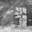 Edinburgh Castle, settlement. Excavation photograph showing area H - possible iron smithing furnace structure filled with 314 and iron object 81 in N half.