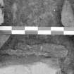 Edinburgh Castle, settlement. Excavation photograph showing area H - detail of iron object 81 in N half of possible iron smithing furnace structure.