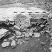 Edinburgh Castle, settlement. Excavation photograph showing area H - earlier wall/rubble cut by construction of W end 254 Charles II wall.