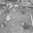 Edinburgh Castle, settlement. Excavation photograph showing area H - excavated post holes cutting 305, close up.