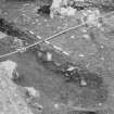 Edinburgh Castle, settlement. Excavation photograph showing area H - excavated base and section of 333.