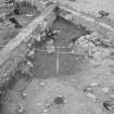 Edinburgh Castle, settlement. Excavation photograph showing area H - pit to W of forge 296 fully excavated.