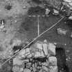 Edinburgh Castle, settlement. Excavation photograph showing area H - pit to W of forge 296 fully excavated.