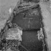 Edinburgh Castle, settlement. Excavation photograph: area H - cobbles and fully excavated wall 254 showing cobbles cut by wall trench.