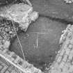 Edinburgh Castle, settlement. Excavation photograph: area H - chocolate brown lower midden at N end under 17th century wall construction.