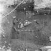 Edinburgh Castle, settlement. Excavation photograph: area H - stone feature sitting on 396 reddish layer.