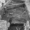 Edinburgh Castle, settlement. Excavation photograph: area H - general view along complete trench with 409 sticky clay layer in foreground.