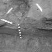 Edinburgh Castle, settlement. Excavation photograph: area H - detail view of damage to E side of iron base.