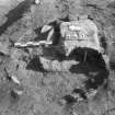 Edinburgh Castle, settlement. Excavation photograph: area H - W facing section of hearth 440 with lower pedestal of orange ash.